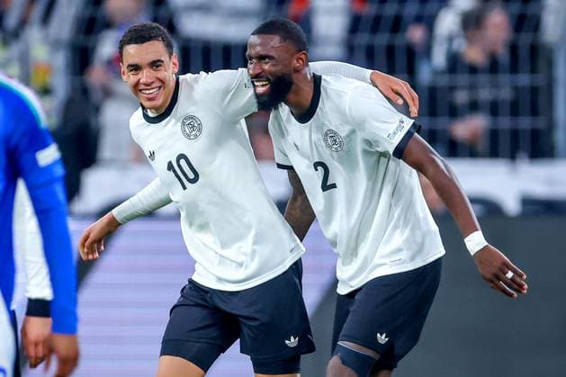 23 03 2025, Football, Quarter-final UEFA Nations League, Germany Italy, Signal Iduna Park, Season 2024 2025 Goal celebration after the 2-0 goal by scorer Jamal Musiala GER 10 together with Antonio Rüdiger GER 02 DFB regulations prohibit any use of photographs as image sequences and or quasi video North Rhine-Westphalia Germany