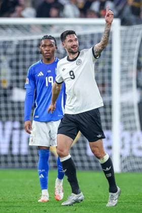 23 03 2025, Football, Quarter-final UEFA Nations League, Germany Italy, Signal Iduna Park, Season 2024 2025 Goal celebration after the goal to 3 0 by scorer Tim Kleindienst GER 09 next to the disappointed Iyenoma Destiny Udogie ITA 19 DFB regulations prohibit any use of photographs as image sequences and or quasi video Nordrhein Westfalen Germany