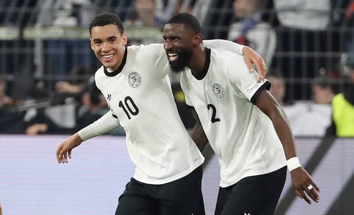Jamal Musiala celebrates after 2 0 with Antonio Rüdiger Joy Emotion Cheers Sport Football Soccer Nations League International match National team DFB Men Season 2024 2025 23 03 2025 Germany GER vs Italy ITA DFL regulations prohibit any use of photographs as image sequences and or quasi video