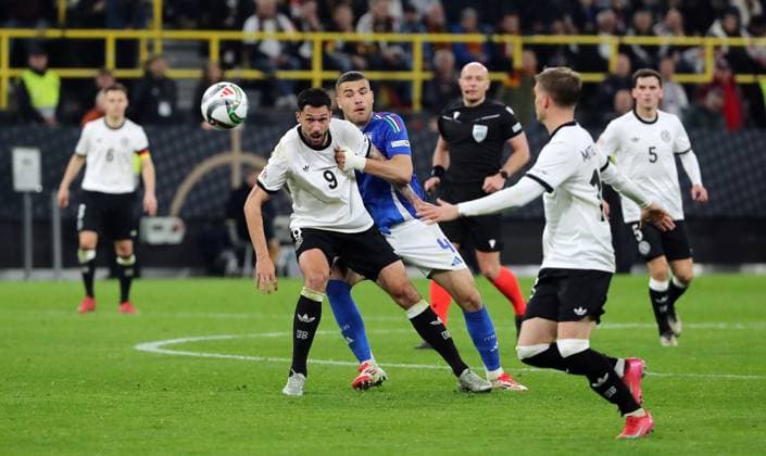 Tim Kleindienst in a duel with Alessandro Buongiorno, Maximilian Mittelstädt Action Match scene Sport Football Soccer Nations League International match National team DFB Men Season 2024 2025 23 03 2025 Germany GER vs Italy ITA DFL regulations prohibit any use of photographs as image sequences and or quasi video