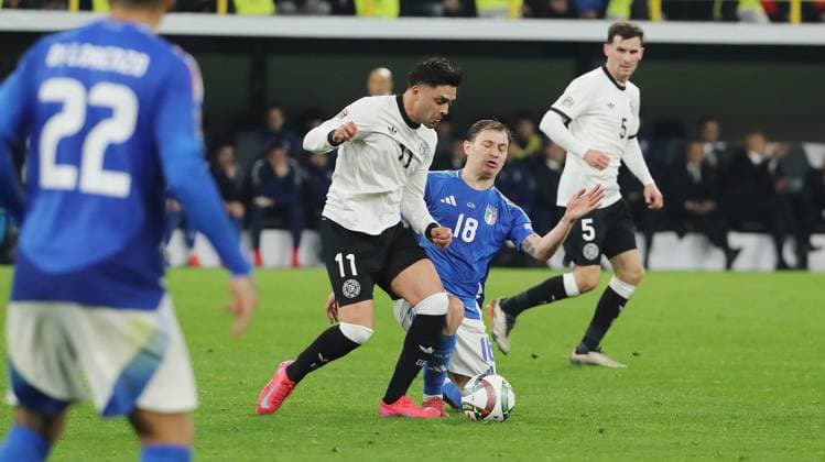 Nadiem Amiri on the ball, Nicolo Barella duel Match scene Action Sport Football Soccer Nations League International match National team DFB Men Season 2024 2025 23 03 2025 Germany GER vs Italy ITA DFL regulations prohibit any use of photographs as image sequences and or quasi video
