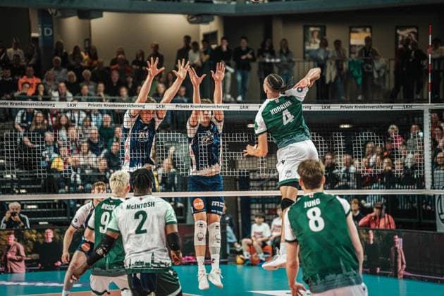 Volleyball Men Season 2024 2025 Volleyball Bundesliga Playoff Quarterfinals Match 1 SVG Lüneburg vs FT 1844 Freiburg 24 03 2025 Kevin Kobrine 4 FT 1844 Freiburg against the block of Joscha Kunstmann 7 SVG Lüneburg and Theo Mohwinkel 8 SVG Lüneburg Lüneburg LKH Arena Niedersachsen Germany
