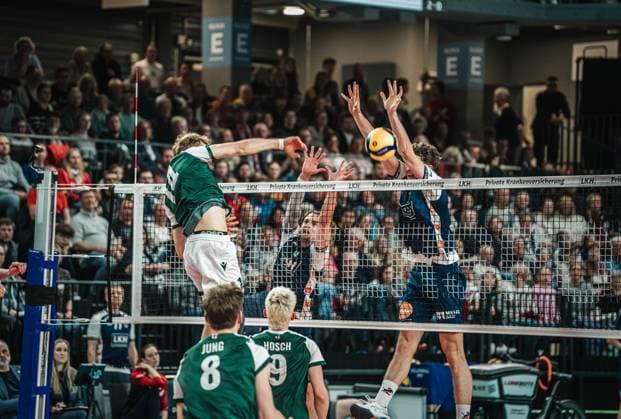 Volleyball Men Season 2024 2025 Volleyball Bundesliga Playoff Quarterfinals Match 1 SVG Lüneburg vs FT 1844 Freiburg 24 03 2025 Charles Figy 14 FT 1844 Freiburg against the block of Michael Patrick Wright 3 SVG Lüneburg and Joscha Kunstmann 7 SVG Lüneburg Lüneburg LKH Arena Niedersachsen Germany