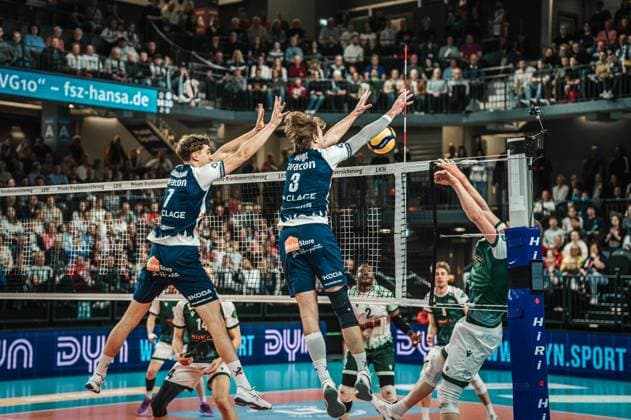 Volleyball Men Season 2024 2025 Volleyball Bundesliga Playoff Quarterfinals Match 1 SVG Lüneburg vs FT 1844 Freiburg 24 03 2025 The block by Joscha Kunstmann 7 SVG Lüneburg and Michael Patrick Wright 3 SVG Lüneburg Lüneburg LKH Arena Niedersachsen Germany