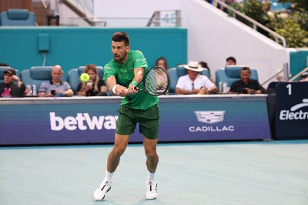 March 25, 2025, Miami Gardens, Florida, United States Of America: MIAMI GARDENS, FLORIDA - MARCH 25: Novak Djokovic of Serbia defeats Lorenzo Musetti of Italy in the fourth round of the men s singles during Day 8 of the Miami Open at Hard Rock Stadium on March 25, 2025 in Miami Gardens, Florida....People: Novak Djokovic Miami Open 2025 - Day 8  - ZUMAs214 20250325_ada_s214_002 Copyright: xSMGx