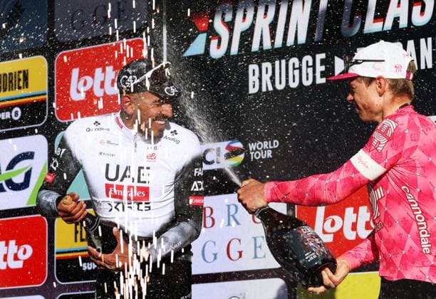 Colombian Juan Sebastian Molano of UAE Team Emirates and Estonian Madis Mihkels of EF Education-EasyPost celebrate on the podium of the Classic Brugge-De Panne men s elite one-day cycling race, 195,6 km from Brugge to De Panne, Wednesday 26 March 2025. KURTxDESPLENTER  x115919331x