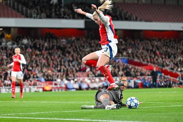 Alessia Russo of Arsenal Women has to leap over the Real Madrid Women player as they both compete for the ball during the Womens Champions League match between Arsenal Women and Real Madrid Women at the Emirates Stadium, London, England on 26 March 2025. Copyright: xPhilxHutchinsonx 42890006