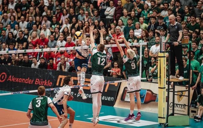 Volleyball Men Season 2024 2025 Volleyball Bundesliga Playoff Quarterfinals Match 2 FT 1844 Freiburg vs SVG Lüneburg 28 03 2025 Theo Mohwinkel 8 SVG Lüneburg against the block of Liam Kristjanson 12 FT 1844 Freiburg and Fabian Hosch 9 FT 1844 Freiburg Freiburg i Br Act Now Arena Baden Würtemberg Germany