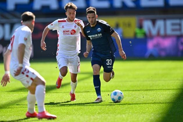Paderborn, Home Deluxe Arena, 29 03 25, GER, Herren, 2 Bundesliga, Saison 2024 2025, SC Paderborn 07 1 FC Koeln Picture from left in duel Luca WALDSCHMIDT Koeln and Marcel HOFFMEIER Paderborn DFL regulations prohibit any use of photographs as image sequences and or quasi video NRW Germany
