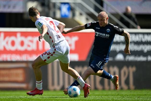 Paderborn, Home Deluxe Arena, 29 03 25, GER, Herren, 2 Bundesliga, Saison 2024 2025, SC Paderborn 07 1 FC Koeln Picture from left in duel Joel Pascal SCHMIED Koeln and Sven MICHEL Paderborn DFL regulations prohibit any use of photographs as image sequences and or quasi video NRW Germany