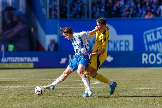 left Sigurd Haugen Rostock vs Sven Sonnenberg FCS GER, FC Hansa Rostock vs 1 FC Saarbrücken, Soccer, Men, 3 Liga, Matchday 30, Season 2024 2025, 29 03 2025 Rostock Ostseestadion Mecklenburg Vorpommern Germany