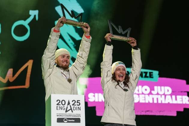 FREE STYLE, SNOWBOARD - FIS SX and SB WC Engadin 2025 SANKT MORITZ,SWITZERLAND,29.MAR.25 - SNOWBOARD - FIS Freestyle Ski and Snowboard World Championships, Champions Celebration, award ceremony, Snowboard Cross, mixed team. Image shows Valerio Jud and Sina Siegenthaler (SUI). Keywords: trophy.  GEPAxpictures xMatthiasxTrinkl