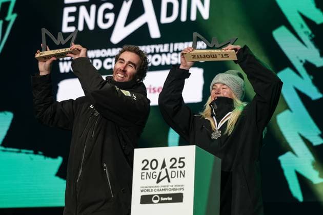 FREE STYLE, SNOWBOARD - FIS SX and SB WC Engadin 2025 SANKT MORITZ,SWITZERLAND,29.MAR.25 - SNOWBOARD - FIS Freestyle Ski and Snowboard World Championships, Champions Celebration, award ceremony, Snowboard Cross, mixed team. Image shows Cameron Bolton and Mia Clift (AUS). Keywords: trophy.  GEPAxpictures xMatthiasxTrinkl