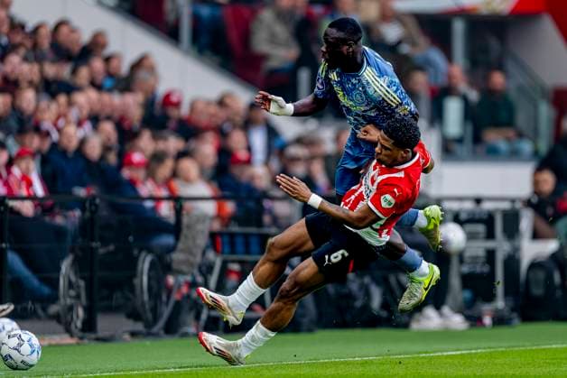 AFC Ajax Amsterdam forwarder Brian Brobbey, PSV Eindhoven defender Ryan Flamingo during the match PSV Ajax at the Philips stadium for the Dutch Eredivisie season 2024 2025 in EINDHOVEN, Netherlands on 30 march 2025, photo by Marcel van Dorst EYE4images DeFodi Images