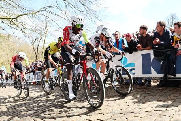 Eritrean Biniam Girmay Hailu of Intermarche-Wanty and Belgian Florian Vermeersch of UAE Team Emirates pictured in action on the Kemmelberg during the men elite Gent-Wevelgem - In Flanders Fields one day cycling race, 250.3 km from Ieper to Wevelgem, Sunday 30 March 2025. DAVIDxPINTENS  x117229788x