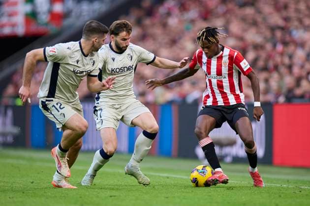 Athletic Club v CA Osasuna - LaLiga EA Sports Nico Williams of Athletic Club competes for the ball with Jesus Areso and Jon Moncayola of CA Osasuna during the LaLiga EA Sports match between Athletic Club and CA Osasuna at San Mames on March 30, 2025, in Bilbao, Spain. Bilbao San Mames Basque Country Spain RL_ATHvCAO_000046 Copyright: xRicardoxLarreinax