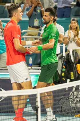 Jakub Mensik from the Czachia is congratulated by Novak Djokovic from Serbia after defeating him in the men s championship match on the stadium court at the Miami Open in the Hard Rock Stadium in Miami Gardens, Florida, on Sunday, March 30, 2025. Mensik defeated Djokovic 7-6 (4), 7-6(4).  MIA20250330114 GARYxIxROTHSTEIN