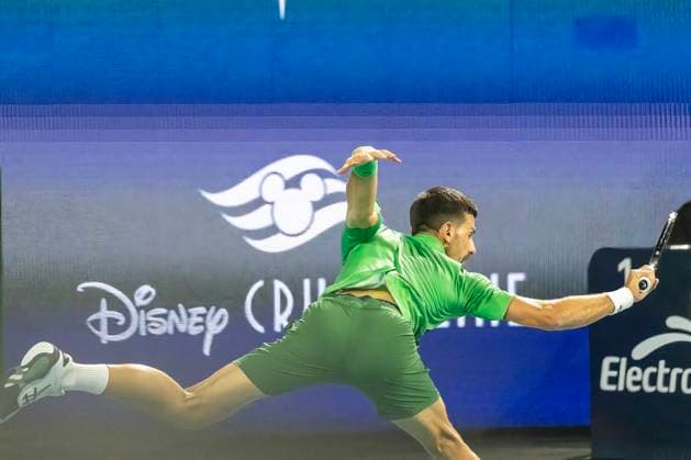Novak Djokovic from Serbia slipped and fell on the court during a return shot to Jakub Mensik from the Czachia in the men s championship match on the stadium court at the Miami Open in the Hard Rock Stadium in Miami Gardens, Florida, on Sunday, March 30, 2025. Mensik defeated Djokovic 7-6 (4), 7-6(4).  MIA20250330118 GARYxIxROTHSTEIN