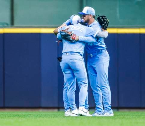 Kansas City Royals outfielders MJ Melendez, Maikel Garcia and Hunter Renfroe embrace after the final out in the ninth inning of the MLB, Baseball Herren, USA baseball game between the Kansas City Royals and the Milwaukee Brewers at American Family Field in Milwaukee, Wisconsin on Monday, March 31, 2025. The game is the Brewers 2025 season home opener. The Royals won the game 11-1.  MIL20250331834 TANNENxMAURY