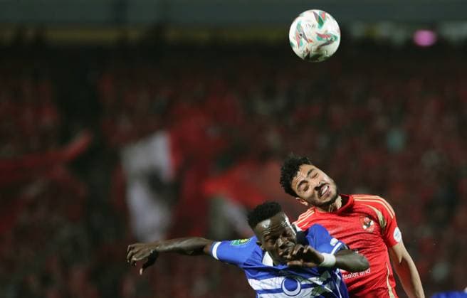 CAF Champions League - Quarter Final - First Leg - Al Ahly vs Al Hilal Omdurman Akram Tawfik (R) of Al Ahly in action against Walisldin Khidir of Al Hilal Omdurman during the CAF Champions League Quarter Final First Leg match between Al Ahly vs Al Hilal Omdurman, in Cairo, Egypt,April 01 2025. Cairo Egypt Copyright: xMatrixxImagesx xKhaledxElfiqix 