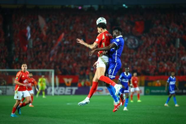 Al Ahly FC vs Al Hilal SC - TotalEnergies CAF Champions League - Quarter Final 1st Leg Wessam Abo Ali gets to the ball with a header before Al Hilal SC defender in the match between Al Ahly FC vs Al Hilal SC in the 1st leg of the Quarter Final of Total Energies CAF Champions League on April 1, 2025 Cairo Cairo Egypt Copyright: xMohamedxTageldinx