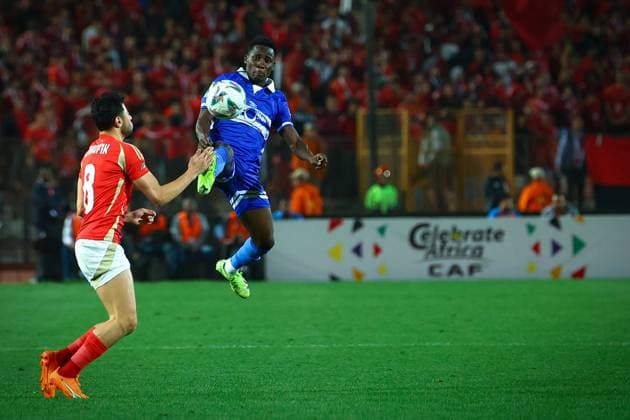 Al Ahly FC vs Al Hilal SC - TotalEnergies CAF Champions League - Quarter Final 1st Leg Jean Claude Girumugisha trying to reach the ball before Akram Tawfik in the match between Al Ahly FC vs Al Hilal SC in the 1st leg of the Quarter Final of Total Energies CAF Champions League on April 1, 2025 Cairo Cairo Egypt Copyright: xMohamedxTageldinx