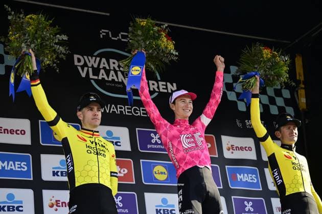Belgian Wout van Aert of Team Visma-Lease a Bike, American Neilson Powless of EF Education-EasyPost and Belgian Tiesj Benoot of Team Visma-Lease a Bike celebrate on the podium of the men elite race of the Dwars Door Vlaanderen cycling event, 184,2km from Roeselare to Waregem, Wednesday 02 April 2025. DIRKxWAEM  x118320748x