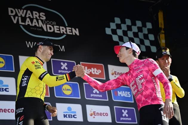 Belgian Wout van Aert of Team Visma-Lease a Bike, American Neilson Powless of EF Education-EasyPost and Belgian Tiesj Benoot of Team Visma-Lease a Bike celebrate on the podium of the men elite race of the Dwars Door Vlaanderen cycling event, 184,2km from Roeselare to Waregem, Wednesday 02 April 2025. DIRKxWAEM  x118322024x