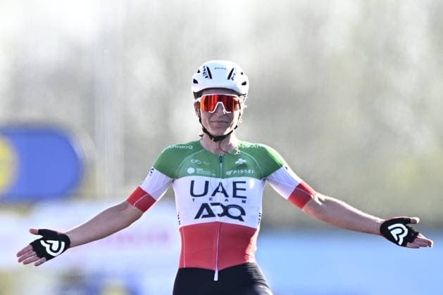 Italian Elisa Longo Borghini of UAE Team ADQ celebrates after winning the women elite race of the Dwars Door Vlaanderen cycling event, 128,5km from and to Waregem, Wednesday 02 April 2025. JASPERxJACOBS  x118336962x
