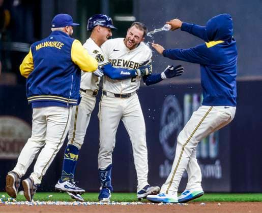 Milwaukee Brewers second baseman Brice Turang (2R) celebrates with teammates after laying down a squeeze play bunt to drive in Milwaukee Brewers third baseman Oliver Dunn in the eleventh inning of the MLB, Baseball Herren, USA baseball game between the Kansas City Royals and the Milwaukee Brewers at American Family Field in Milwaukee, Wisconsin on Wednesday, April 02, 2025. The Brewers won the dame 3-2.  MIL20250402836 TANNENxMAURY