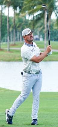 April 4, 2025, Doral, Florida, USA: Bryson DeChambeau (R) of Crushers GC watches his fairway approach shot on the 18th hole during the first round of LIV Golf Miami at Trump National Doral. Doral USA - ZUMAw109 20250404_fap_w109_005 Copyright: xDebbyxWongx