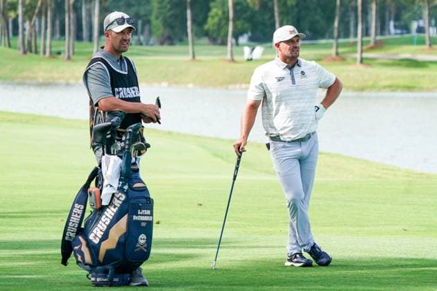 April 4, 2025, Doral, Florida, USA: Bryson DeChambeau (R) of Crushers GC and his caddie, Tim Tucker, wait on the 18th fairway during the first round of LIV Golf Miami at Trump National Doral. Doral USA - ZUMAw109 20250404_fap_w109_011 Copyright: xDebbyxWongx