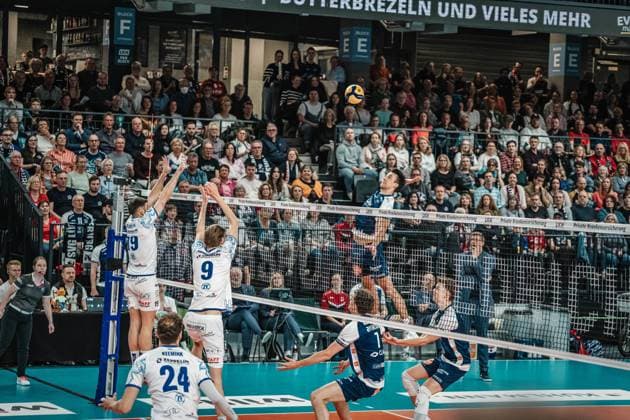 Volleyball Men Season 2024 2025 Volleyball Bundesliga Playoff Semifinal Match 1 SVG Lüneburg vs VfB Friedrichshafen 05 04 2025 Xander Wolf Wassenaar Ketrzynski 11 SVG Lüneburg against the block of Ivan Zeljkovic 19 VfB Friedrichshafen and Severi Seth Savonsalmi 9 VfB Friedrichshafen Lüneburg LKH Arena Niedersachsen Germany