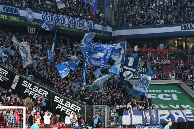 Fans Hertha BSC Berlin with flags banner during the 2 Bundesliga match between 1 FC Köln and Hertha BSC Berlin at RheinEnergieStadion on April 05, 2025 in Cologne, Germany Photo by Ralf Treese DeFodi Images Fans Hertha BSC Berlin with flags banner during the 2 Bundesliga match between 1 FC Köln and Hertha BSC Berlin at RheinEnergieStadion on April 5, 2025 in Cologne, Germany Photo by Ralf Treese DeFodi Images DFB DFL REGULATIONS PROHIBIT ANY USE OF PHOTOGRAPHS AS IMAGE SEQUENCES AND OR QUASI VIDEO Photo by Ralf Treese DeFodi Images