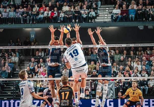 Volleyball Men Season 2024 2025 Volleyball Bundesliga Playoff Semifinal Match 1 SVG Lüneburg vs VfB Friedrichshafen 05 04 2025 Ivan Zeljkovic 19 VfB Friedrichshafen against the block of Xander Wolf Wassenaar Ketrzynski 11 SVG Lüneburg , Simon Torwie 1 SVG Lüneburg and Theo Mohwinkel 8 SVG Lüneburg Lüneburg LKH Arena Niedersachsen Germany