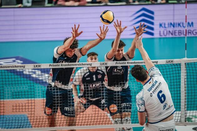 Volleyball mens season 2024 2025 Volleyball Bundesliga playoff semi-final match 1 SVG Lüneburg vs VfB Friedrichshafen 05 04 2025 Michal Superlak 6 VfB Friedrichshafen against Joscha Kunstmanns block 7 SVG Lüneburg and Theo Mohwinkel 8 SVG Lüneburg Lüneburg LKH Arena Niedersachsen Germany