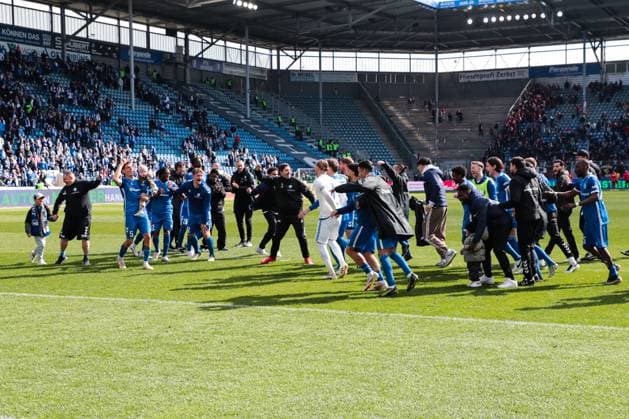 The team of 1 FC Magdeburg celebrates the victory in front of the fan block 2 Soccer Bundesliga season 2024 2025 1 FC Magdeburg vs 1 FC Kaiserslautern at the Avnet Arena in Magdeburg Action,Soccer,Man,Men,Germany,06 04 2025
