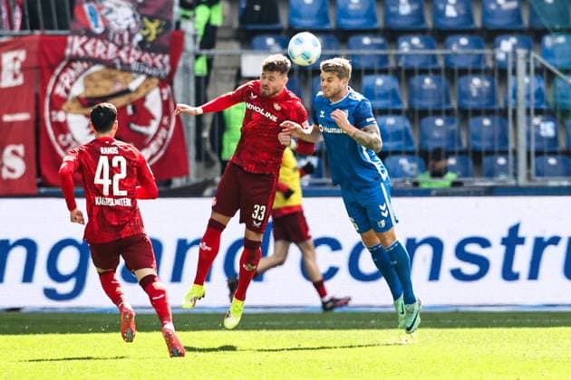 Jan Elvedi 1 FC Kaiserslautern,33 vs Marcus Mathisen 1 FC Magdeburg,16 2 Soccer Bundesliga Season 2024 2025 1 FC Magdeburg vs 1 FC Kaiserslautern at the Avnet Arena in Magdeburg Action,Soccer,Man,Men,Germany,06 04 2025