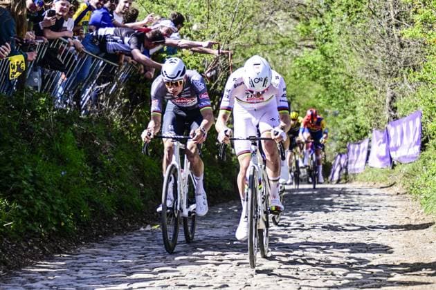 Dutch Mathieu van der Poel of Alpecin-Deceuninck and Slovenian Tadej Pogacar of UAE Team Emirates pictured in action on Koppenberg during the men s race of the Ronde van Vlaanderen Tour des Flandres Tour of Flanders one day cycling race, 268,9km from Brugge to Oudenaarde, Sunday 06 April 2025. DIRKxWAEM  x119623859x