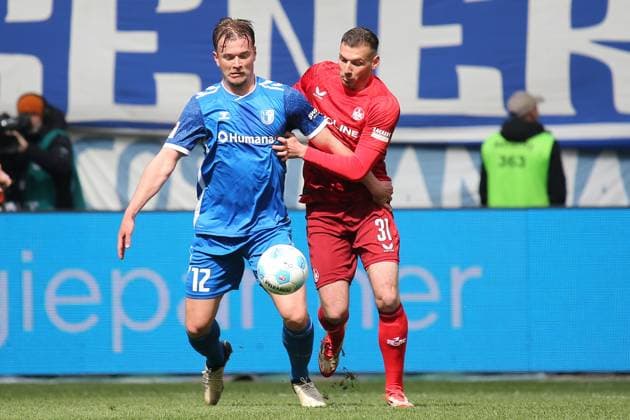 06 04 2025, xmohx, Soccer 2 Bundesliga, 1 FC Magdeburg 1 FC Kaiserslautern v l Alexander Ahl Holmström 1 FC Magdeburg Luca Sirch 1 FC Kaiserslautern Zweikampf, Aktion, action, battle for the ball DFL DFB REGULATIONS PROHIBIT ANY USE OF PHOTOGRAPHS as IMAGE SEQUENCES and or QUASI VIDEO Magdeburg