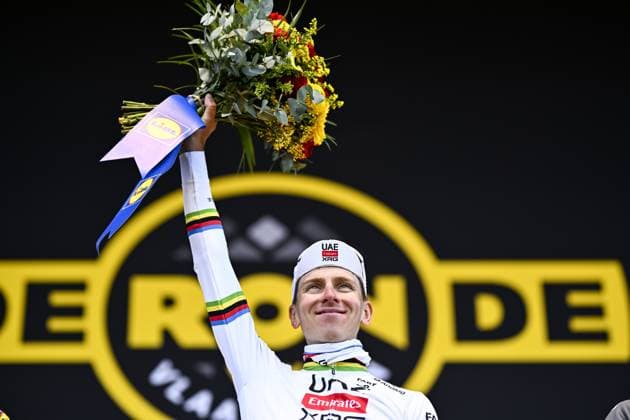 Slovenian Tadej Pogacar of UAE Team Emirates celebrates on the podium after winning the men s race of the Ronde van Vlaanderen Tour des Flandres Tour of Flanders one day cycling race, 268,9km from Brugge to Oudenaarde, Sunday 06 April 2025. JASPERxJACOBS  x119657036x