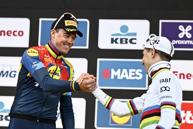 Danish Mads Pedersen of Lidl-Trek and Slovenian Tadej Pogacar of UAE Team Emirates pictured on the podium after the men s race of the Ronde van Vlaanderen Tour des Flandres Tour of Flanders one day cycling race, 268,9km from Brugge to Oudenaarde, Sunday 06 April 2025. ERICxLALMAND  x119658502x