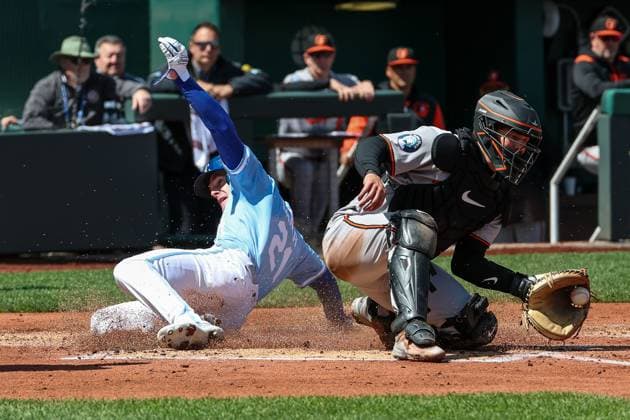 MLB, Baseball Herren, USA 2025: Orioles Vs Royals APR 06 April 6, 2025: Kansas City Royals left fielder Mark Canha (21) slides into home plate safe to score on an RBI double by Kansas City Royals second baseman Michael Massey (19), not shown, as Baltimore Orioles catcher Adley Rutschman (35) catches the ball during the first inning of an MLB baseball game at Kauffman Stadium in Kansas City, MO. David Smith CSM (Credit Image: Â David Smith Cal Media) Kansas City Mo United States of America EDITORIAL USE ONLY Copyright: xx ZUMA-20250406_zma_c04_041.jpg DavidxSmithx csmphotothree373499