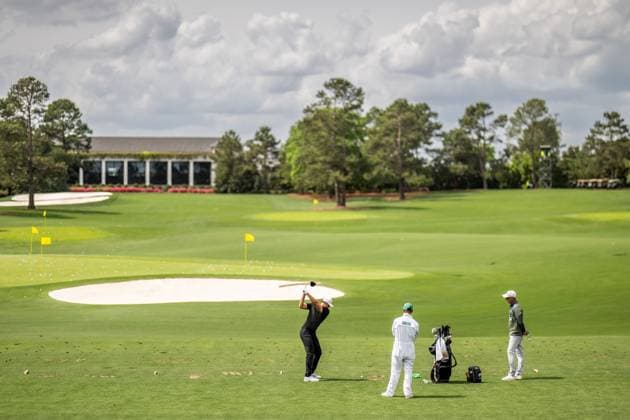 250406 Ludvig Aberg of Sweden with caddie Joe Skovron and coach Hans Larsson during a practice at the range prior to the 2025 Masters Golf Tournament on April 6, 2025 in Augusta Photo Petter Arvidson BILDBYRAN kod PA PA1003 golf masters bbeng the masters augusta sverige  Copyright: PETTERxARVIDSON BB250406PA036