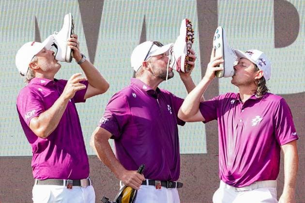 April 6, 2025, Doral, Florida, USA: (L-R) Matt Jones, Marc Leishman, and Cameron Smith drink a shoey after the final round of LIV Golf Miami at Trump National Doral. Doral USA - ZUMAw109 20250406_fap_w109_036 Copyright: xDebbyxWongx