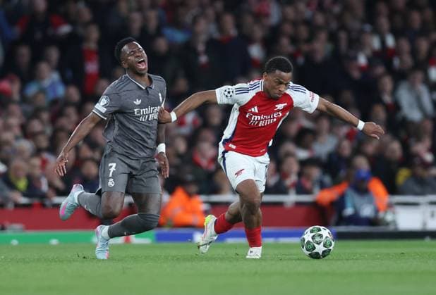 London, England, 8th April 2025. Vinicius Junior of Real Madrid and Jurrien Timber of Arsenal during the Arsenal vs Real Madrid UEFA Champions League match at the Emirates Stadium, London. Picture credit should read: David Klein Sportimage EDITORIAL USE ONLY. No use with unauthorised audio, video, data, fixture lists, club league logos or live services. Online in-match use limited to 120 images, no video emulation. No use in betting, games or single club league player publications. SPI_044_DK_Arsenal_Real_Madrid SPI-3819-0043