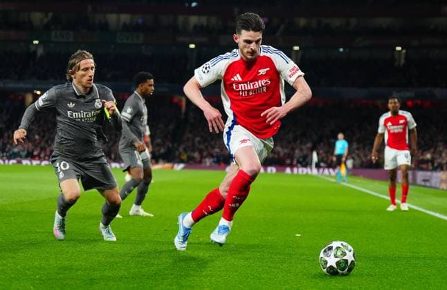 Declan Rice of Arsenal and Luka Modric of Real Madrid in action Arsenal v Real Madrid, UEFA Champions League, Quarter Final, First Leg, Football, Emirates Stadium, London, UK - 08 Apr 2025 EDITORIAL USE ONLY No use with unauthorised audio, video, data, fixture lists, club league logos or live services. Online in-match use limited to 120 images, no video emulation. No use in betting, games or single club league player publications. Copyright: xJavierxGarcia Shutterstockx 15243595ab