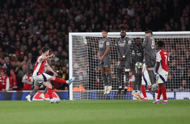 London, England, 8th April 2025. Declan Rice of Arsenal scores the first goal from a free kick during the Arsenal vs Real Madrid UEFA Champions League match at the Emirates Stadium, London. Picture credit should read: David Klein Sportimage EDITORIAL USE ONLY. No use with unauthorised audio, video, data, fixture lists, club league logos or live services. Online in-match use limited to 120 images, no video emulation. No use in betting, games or single club league player publications. SPI_051_DK_Arsenal_Real_Madrid SPI-3819-0053