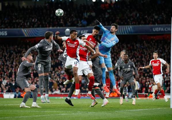Thibaut Courtois the Real Madrid goalkeeper punches clear under pressure from Arsenal players (l-r) Jurrien Timber, Mikel Merino and William Saliba Arsenal v Real Madrid, Football, UEFA Champions League, Emirates Stadium, Islington, London, UK - 08 04 2025 Editorial use only  Copyright: xMattxImpey Shutterstockx 15244749ax