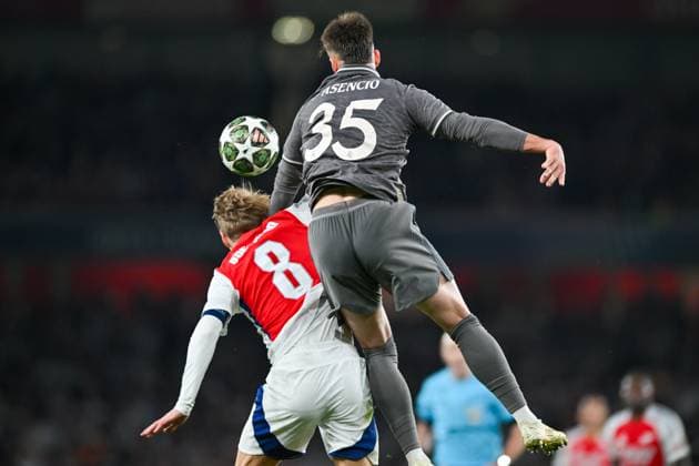 Raul Asencio of Real Madrid and Martin Odegaard of Arsenal FC challenge for the high ball during the UEFA Champions League Quarter Final match between Arsenal and Real Madrid at the Emirates Stadium, London, England on 8 April 2025. Copyright: xPhilxHutchinsonx 42970029